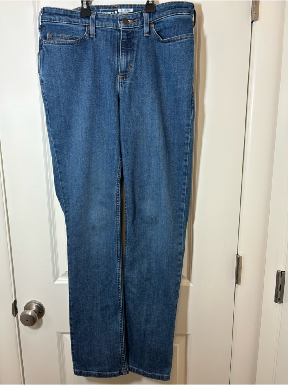 Carhartt Relaxed Fit Denim Jeans in Dark Blue with Tan Stitching